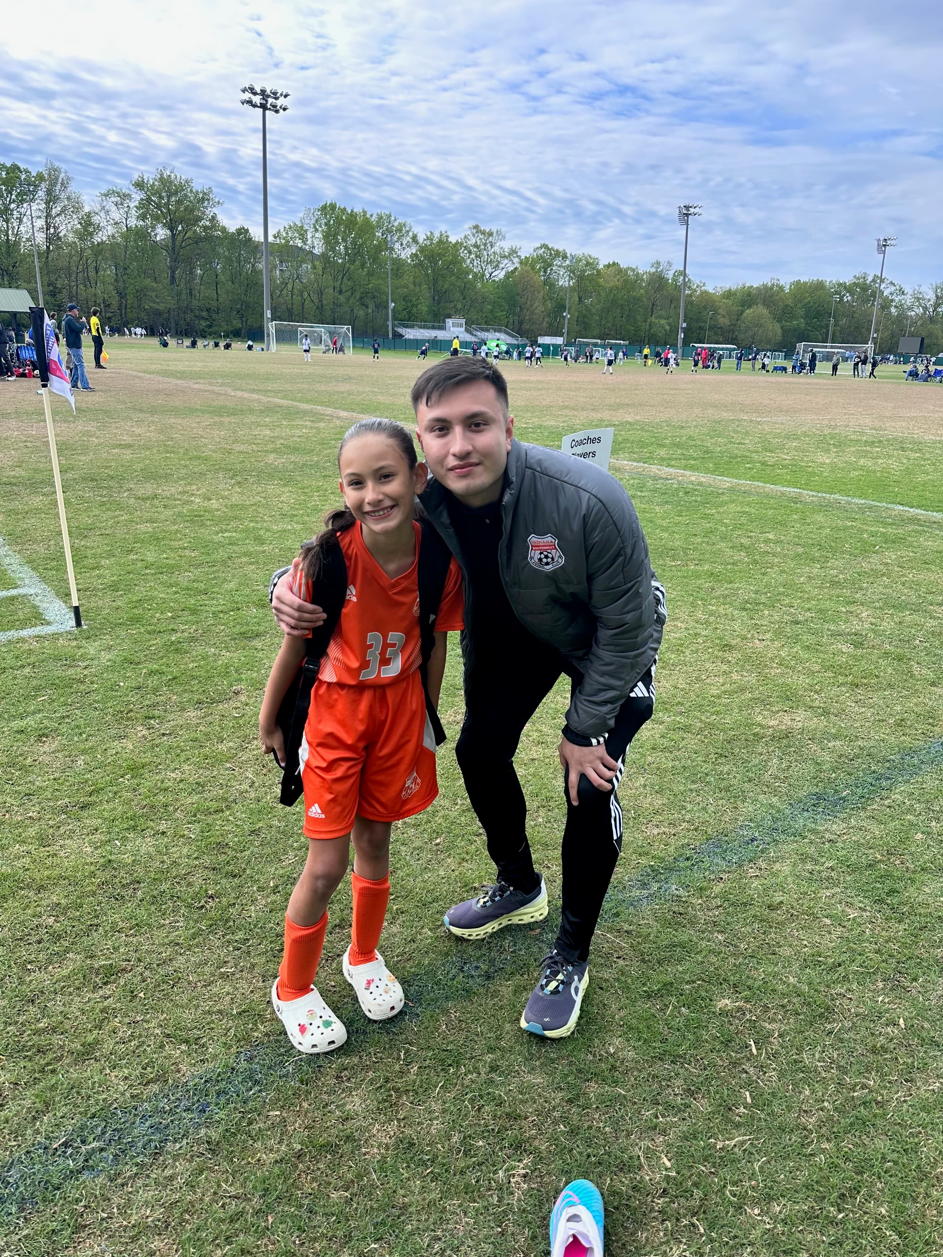 Coach Angel with young soccer player
