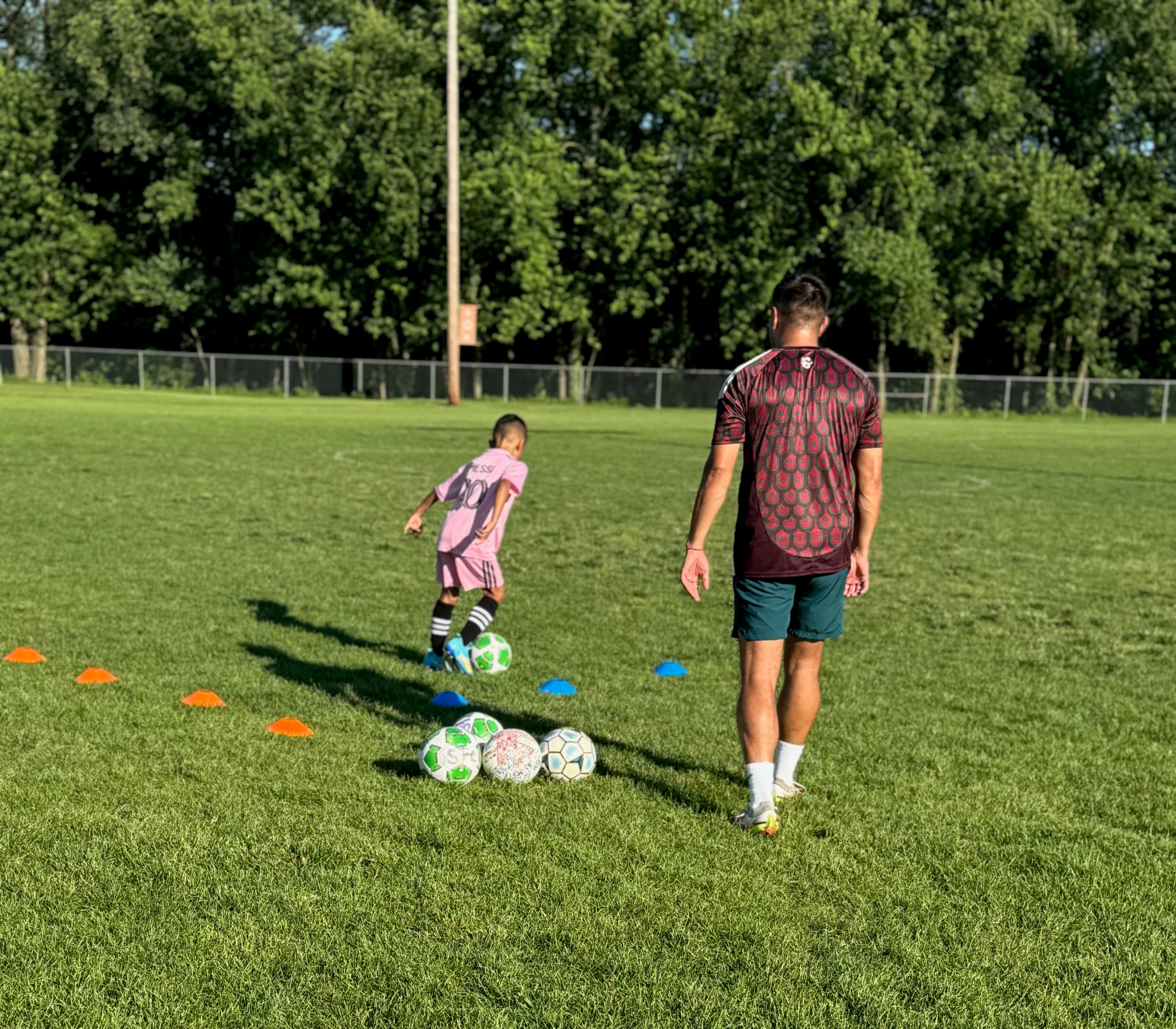 Coach Angel working with soccer players