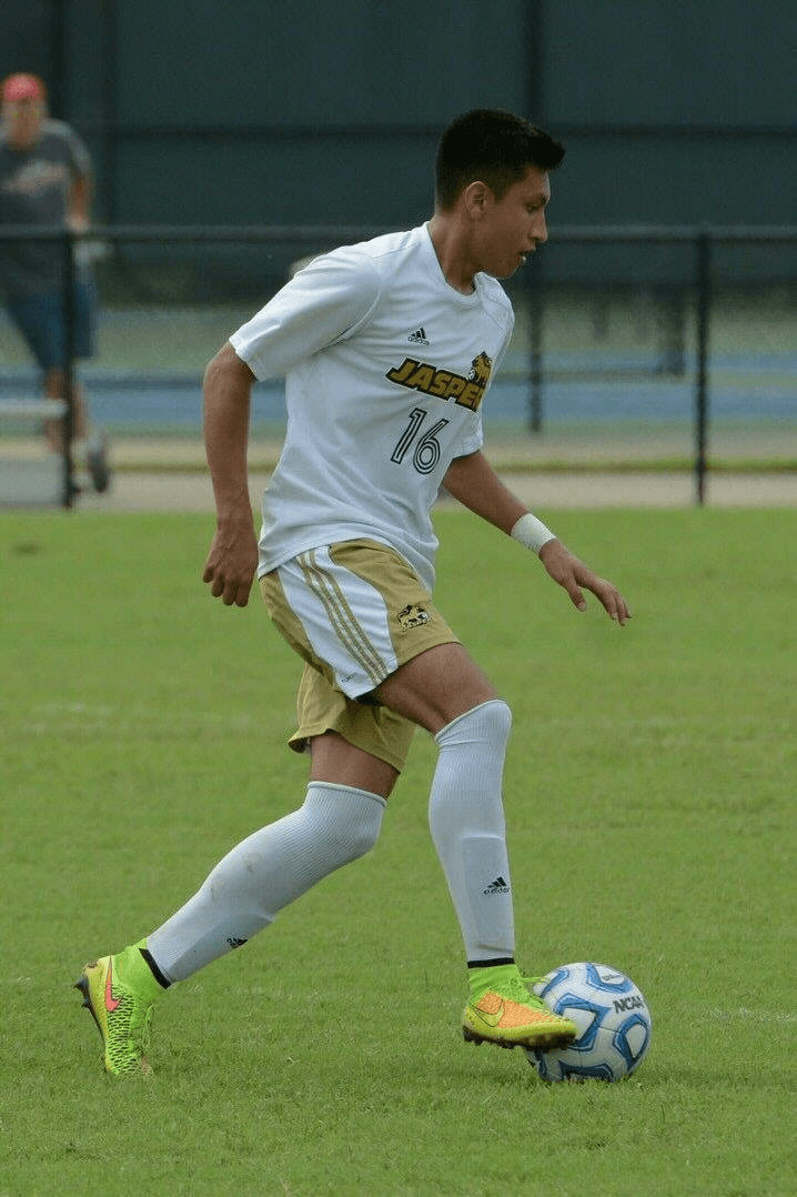 Coach Angel working with soccer players